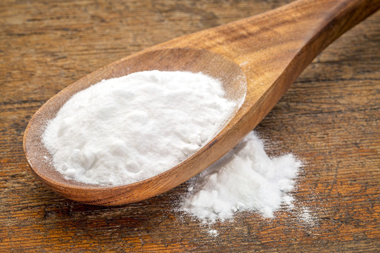 baking soda (Sodium bicarbonate) on a wooden spoon