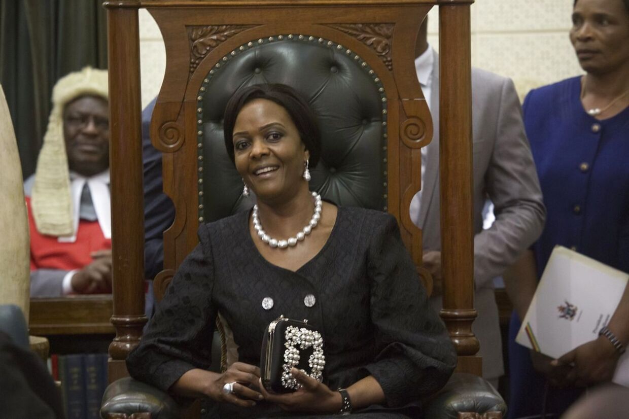 epa06200576 Zimbabwean First Lady Grace Mugabe (C) smiles during the official opening of the Fifth Session of the Eighth Parliament of Zimbabwe in Harare, Zimbabwe, 12 September 2017. The Fifth Session will be the last before the 2018 elections of which the date is yet to be set. EPA/AARON UFUMELI
