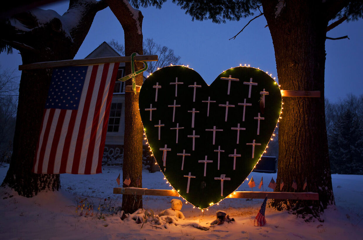 A heart that bears 26 crosses for each victim is surrounded by lights the Sandy Hook portion of Newtown, Connecticut December 14, 2013. Today marks the one year anniversary of the shooting rampage at Sandy Hook Elementary School, where 20 children and six adults were killed by gunman Adam Lanza REUTERS/Carlo Allegri (UNITED STATES - Tags: CRIME LAW)