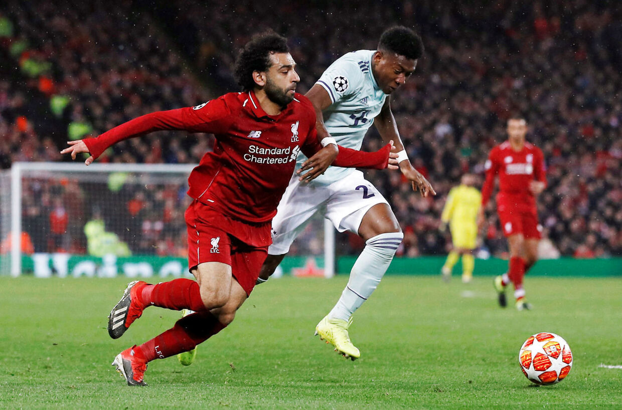 Soccer Football - Champions League - Round of 16 First Leg - Liverpool v Bayern Munich - Anfield, Liverpool, Britain - February 19, 2019 Liverpool's Mohamed Salah in action with Bayern Munich's David Alaba REUTERS/Phil Noble