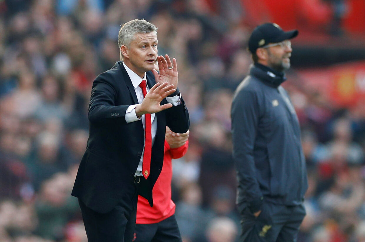 Soccer Football - Premier League - Manchester United v Liverpool - Old Trafford, Manchester, Britain - February 24, 2019 Manchester United interim manager Ole Gunnar Solskjaer reacts as Liverpool manager Juergen Klopp looks on REUTERS/Phil Noble EDITORIAL USE ONLY.No use with unauthorized audio, video, data, fixture lists, club/league logos or "live" services. Online in-match use limited to 75 images, no video emulation.No use in betting, games or single club/league/player publications. Please contact your account representative for further details.
