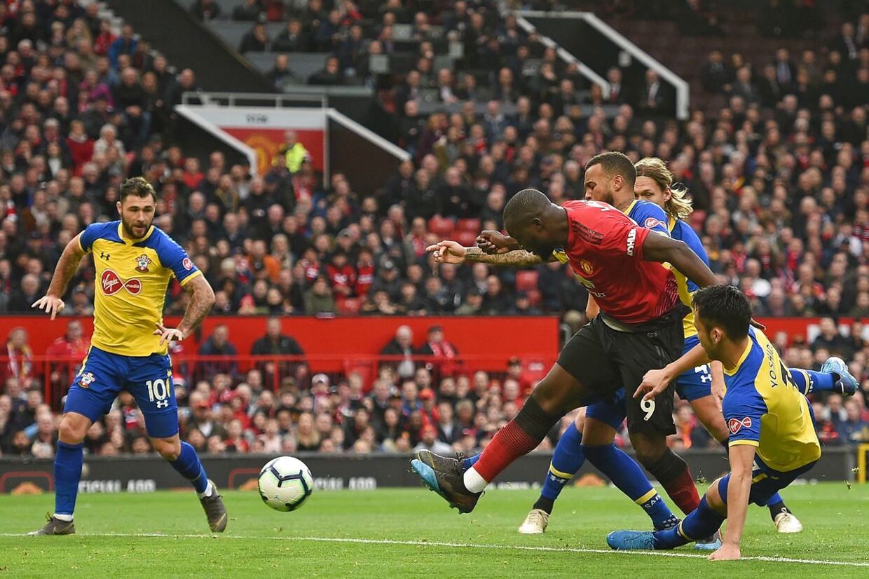 Manchester United's Belgian striker Romelu Lukaku (2nd R) has this shot saved during the English Premier League football match between Manchester United and Southampton at Old Trafford in Manchester, north west England, on March 2, 2019. (Photo by Oli SCARFF / AFP) / RESTRICTED TO EDITORIAL USE.No use with unauthorized audio, video, data, fixture lists, club/league logos or 'live' services. Online in-match use limited to 120 images. An additional 40 images may be used in extra time.No video emulation. Social media in-match use limited to 120 images. An additional 40 images may be used in extra time.No use in betting publications, games or single club/league/player publications. /