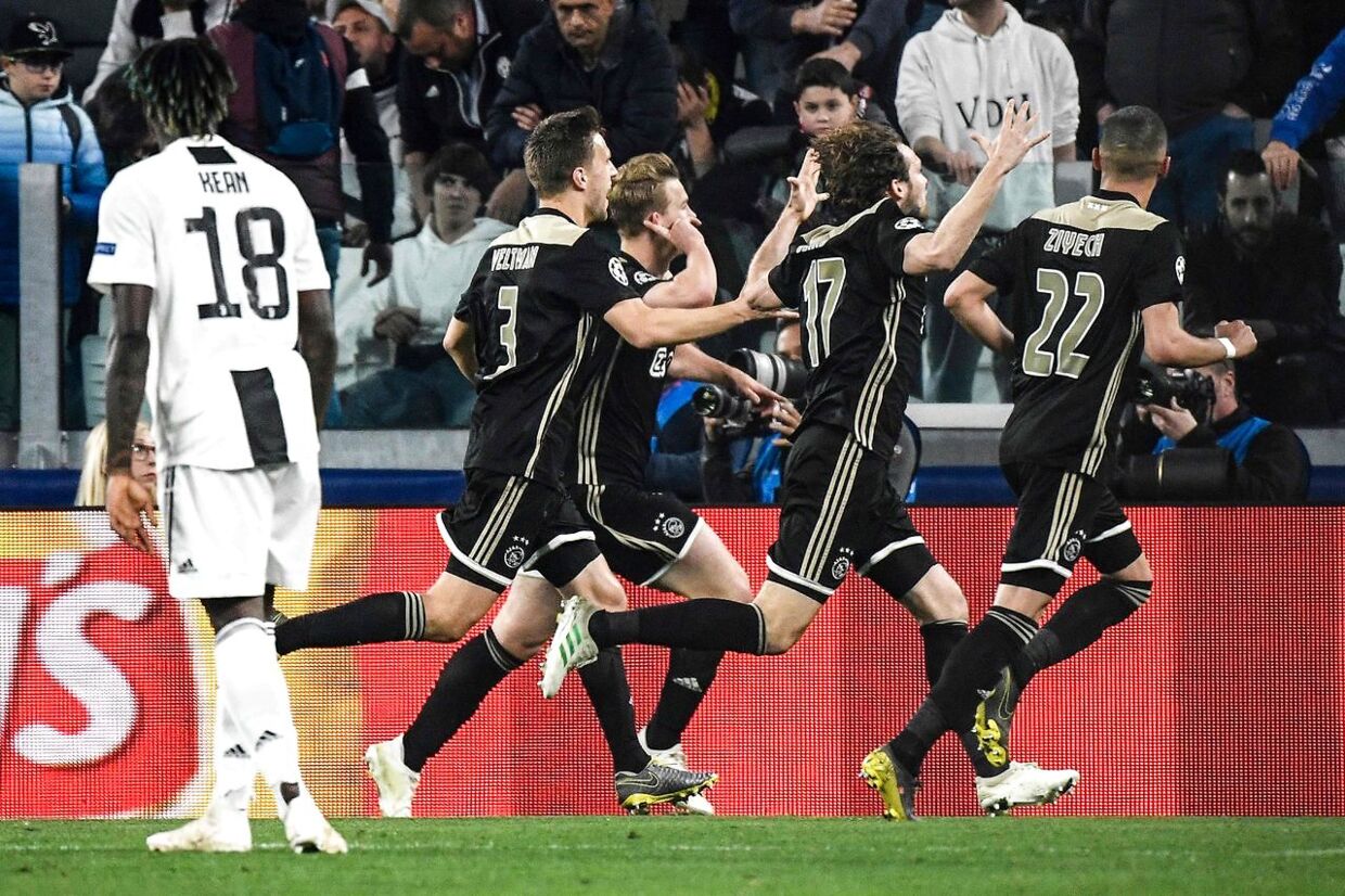 Ajax's Dutch defender Matthijs de Ligt (Rear C) celebrates after scoring his team's second goal during the UEFA Champions League quarter-final second leg football match Juventus vs Ajax Amsterdam on April 16, 2019 at the Juventus stadium in Turin. (Photo by Filippo MONTEFORTE / AFP)