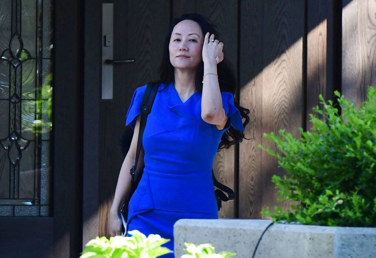 Huawei CFO Meng Wanzhou leaves her Vancouver home to attend her extradition hearing in British Columbia Supreme Court, on August 4, 2021, in Vancouver, Canada. - Meng is back in a Canadian court on for a final round of hearings on her possible extradition to the US, after nearly three years of court battles and diplomatic sparring. Meng, the daughter of company founder and CEO Ren Zhengfei, is fighting extradition to the US, which wants to try her for bank fraud and conspiracy for allegedly concealing her company's business dealings, through a subsidiary, in Iran. (Photo by Don MacKinnon / AFP)