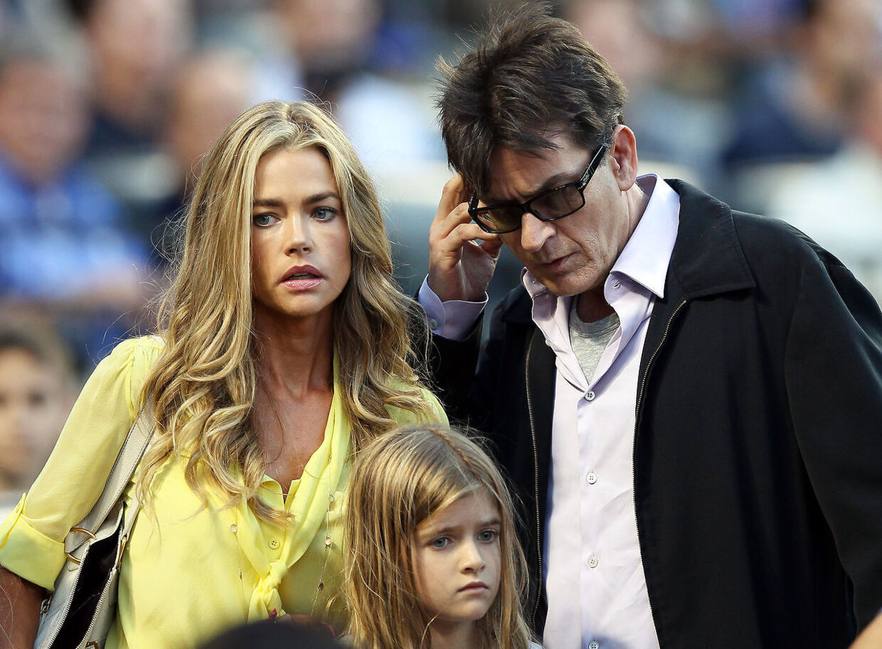 NEW YORK, NY - JUNE 23: Denise Richards and Charlie Sheen look for their seats as the New York Yankees take on the New York Mets on June 23, 2012 during interleague play at Citi Field in the Flushing neighborhood of the Queens borough of New York City. Elsa/Getty Images/AFP