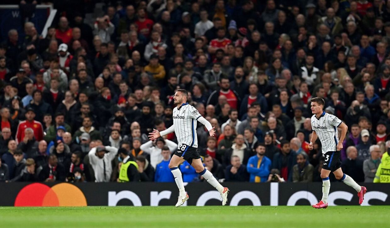 Atalanta's Turkish defender Demiral celebrates scoring his team's second goal during the UEFA Champions league group F football match between Manchester United and Atalanta at Old Trafford stadium in Manchester, north west England, on October 20, 2021. (Photo by Paul ELLIS / AFP)