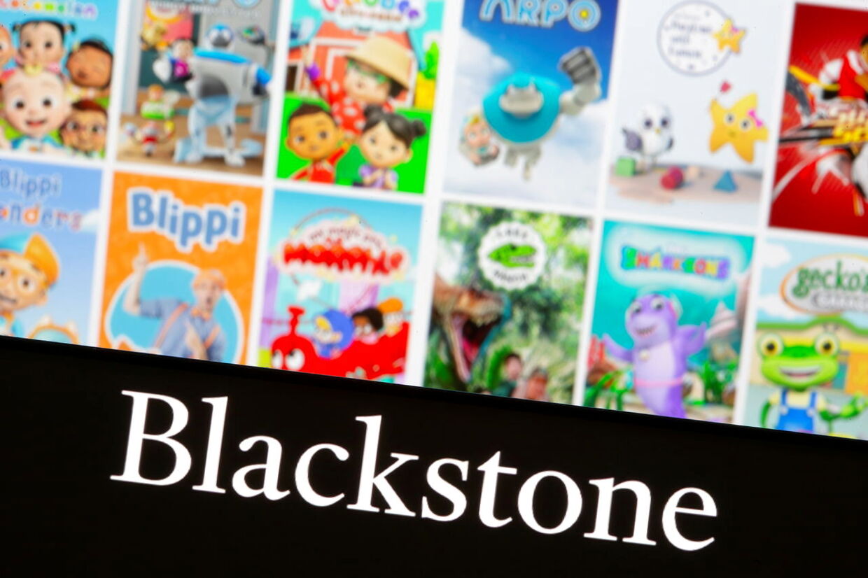 Blackstone logo is seen on a smartphone in front of displayed Moonbug cartoons in this illustration taken November 4, 2021. REUTERS/Dado Ruvic/Illustration