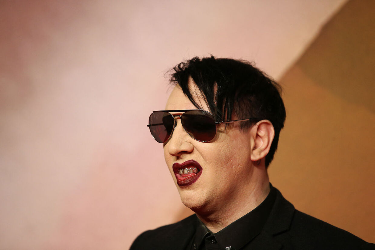 US singer Marilyn Manson poses for pictures on the red carpet upon arrival to attend the British Fashion Awards 2016 in London on December 5, 2016. Daniel LEAL / AFP