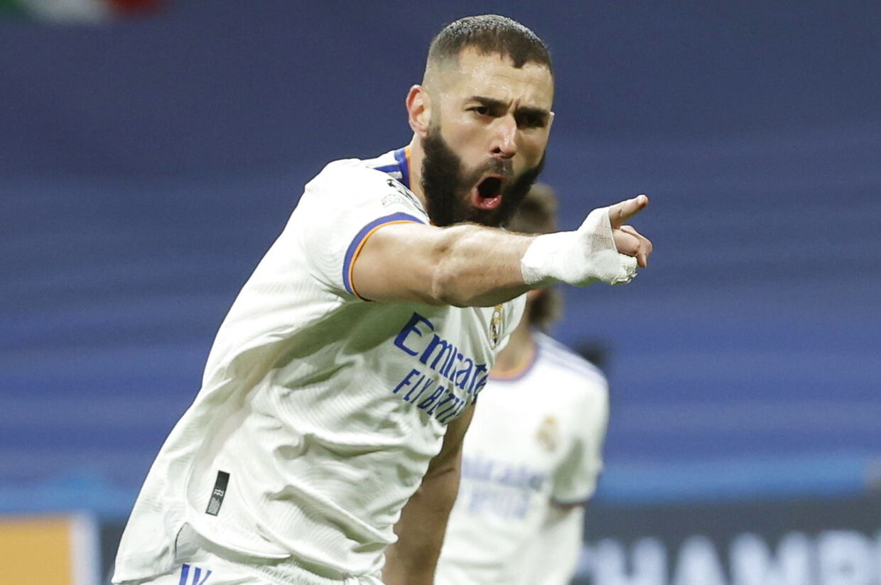 epa09813670 Real Madrid's Karim Benzema celebrates after scoring the 1-1 equalizer during the UEFA Champions League round of 16, second leg soccer match between Real Madrid and Paris Saint-Germain (PSG) in Madrid, Spain, 09 March 2022. EPA/Juanjo Martin