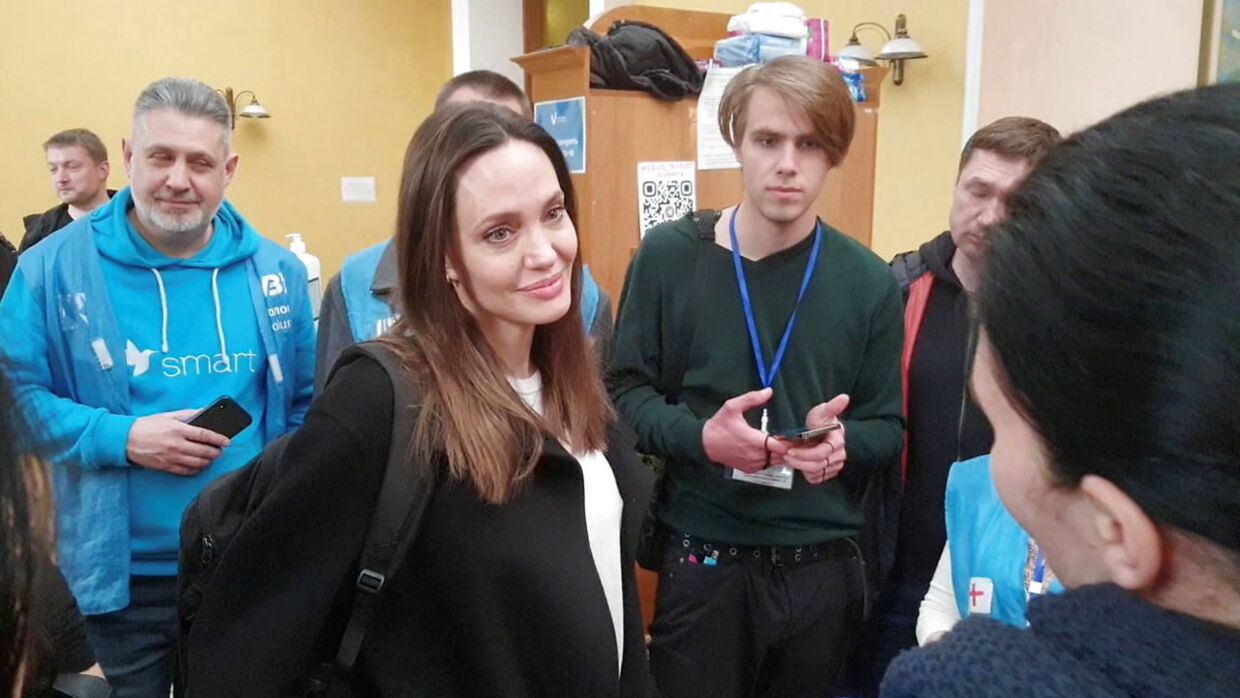 U.S. actor and UNHCR Special Envoy Angelina Jolie listens while meeting with volunteers during a visit to Lviv's main railway station, amid Russia's invasion of Ukraine April 30, 2022 in this still image obtained from handout video. Ukrzaliznytsia/Handout via REUTERS ATTENTION EDITORS - THIS IMAGE HAS BEEN PROVIDED BY A THIRD PARTY. MANDATORY CREDIT.