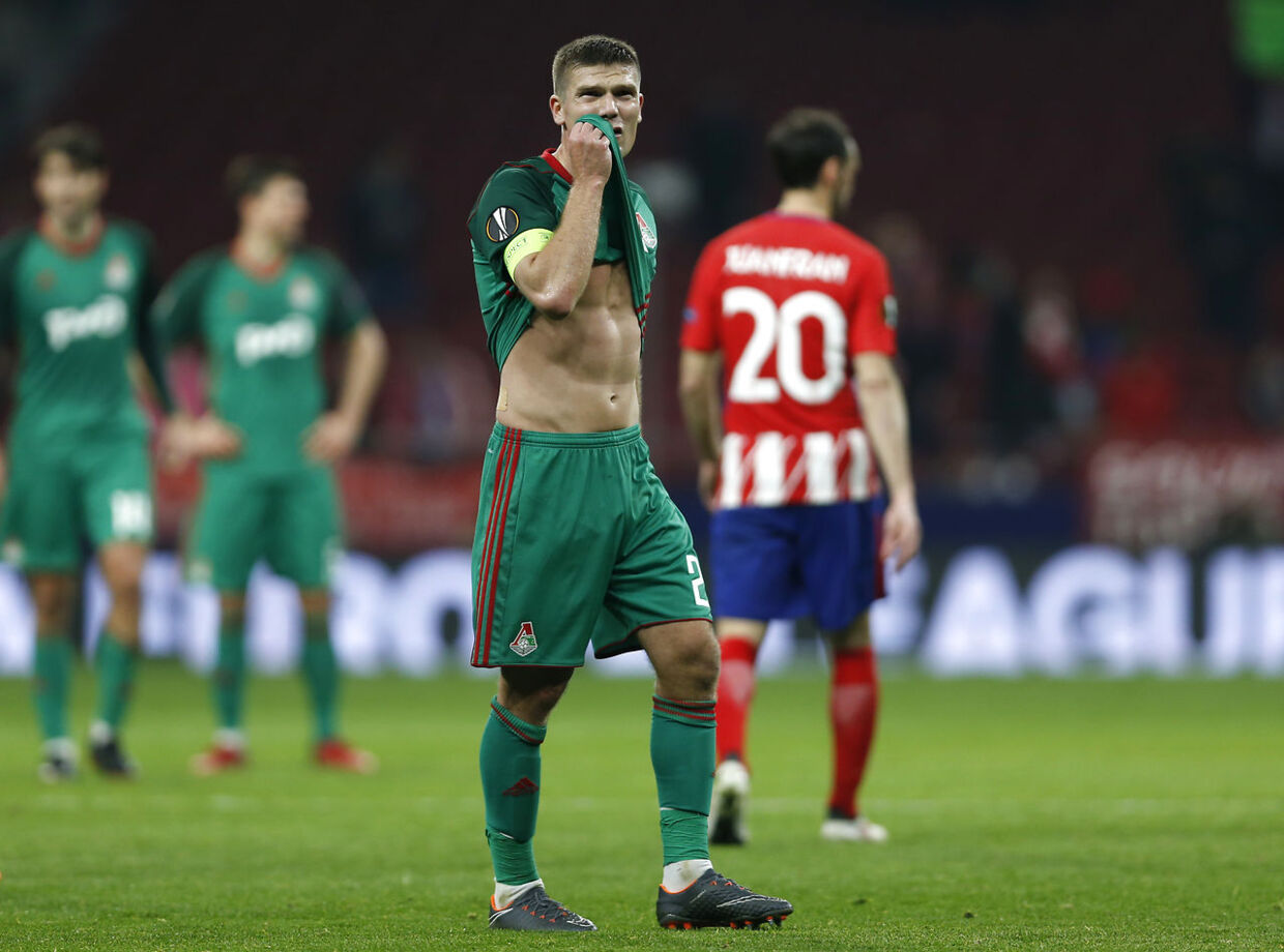 Lokomotiv's Igor Denisov looks at supporters at the end of the Europa League Round of 16 first leg soccer match between Atletico Madrid and Lokomotiv Moscow at the Metropolitano stadium in Madrid, Thursday, March 8, 2018. (AP Photo/Francisco Seco)