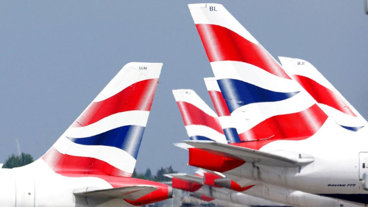 FILE PHOTO: British Airways tail fins are pictured at Heathrow Airport in London, Britain, May 17, 2021. REUTERS/John Sibley/File Photo