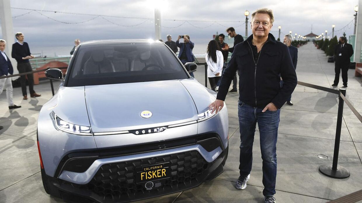 Henrik Fisker stands with the Fisker Ocean electric vehicle after it was unveiled at the Manhattan Beach Pier ahead of the Los Angeles Auto Show and AutoMobilityLA on November 16, 2021 in Manhattan Beach, California. Patrick T. FALLON / AFP