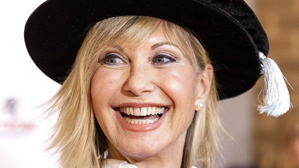 epa08092529 (FILE) - British-Australian singer and actress Olivia Newton-John talks to the media ahead of receiving an Honorary Doctorate of Letters at a special graduation ceremony at La Trobe University, Union Hall, Melbourne, Victoria, Australia, 14 May 2018 (reissued 28 December 2019). According to media reports, Olivia Newton-John is recognized on British Queen Elizabeth's New Year's Honour List for 2020. EPA/DANIEL POCKETT AUSTRALIA AND NEW ZEALAND OUT *** Local Caption *** 54638252
