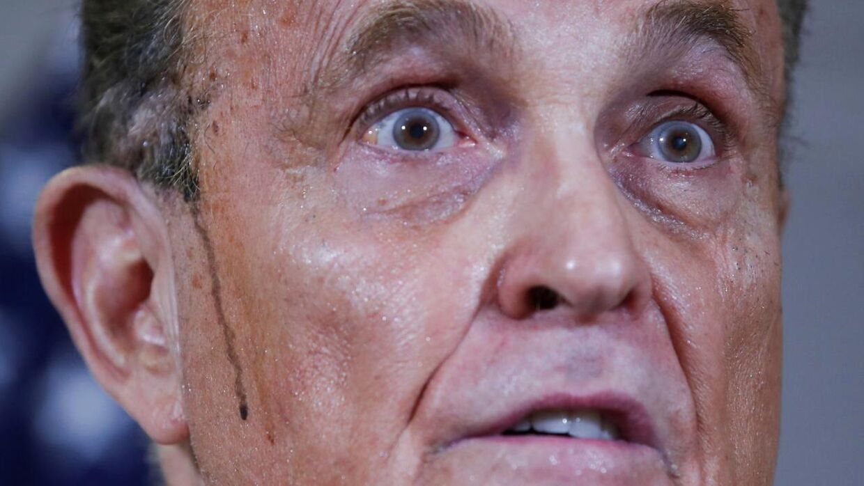 Former New York City Mayor Rudy Giuliani, personal attorney to U.S. President Donald Trump, speaks as sweat runs down his cheek during a news conference about the 2020 U.S. presidential election results held at Republican National Committee headquarters in Washington, U.S., November 19, 2020. REUTERS/Jonathan Ernst
