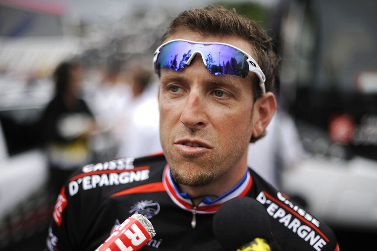 France's Christophe Moreau answers a journalist's question on July 9, 2010 prior to the start of the 227, 5 km and 6th stage of the 2010 Tour de France cycling race run between Montargis and Gueugnon, center France. AFP PHOTO / NATHALIE MAGNIEZ