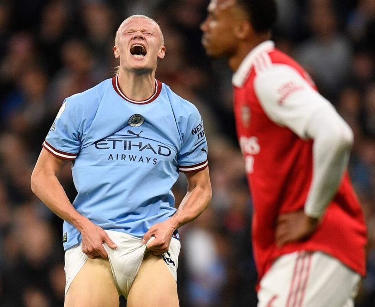 TOPSHOT - Manchester City's Norwegian striker Erling Haaland reacts after failing to score during the English Premier League football match between Manchester City and Arsenal at the Etihad Stadium in Manchester, north west England, on April 26, 2023. (Photo by Oli SCARFF / AFP) / RESTRICTED TO EDITORIAL USE.No use with unauthorized audio, video, data, fixture lists, club/league logos or 'live' services. Online in-match use limited to 120 images. An additional 40 images may be used in extra time.No video emulation. Social media in-match use limited to 120 images. An additional 40 images may be used in extra time.No use in betting publications, games or single club/league/player publications. /