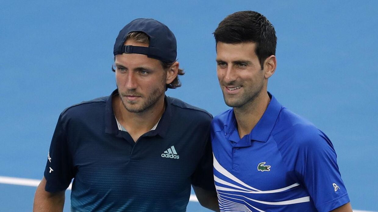 Lucas Pouille og Novak Djokovic efter semifinalen ved Australian Open 2019.