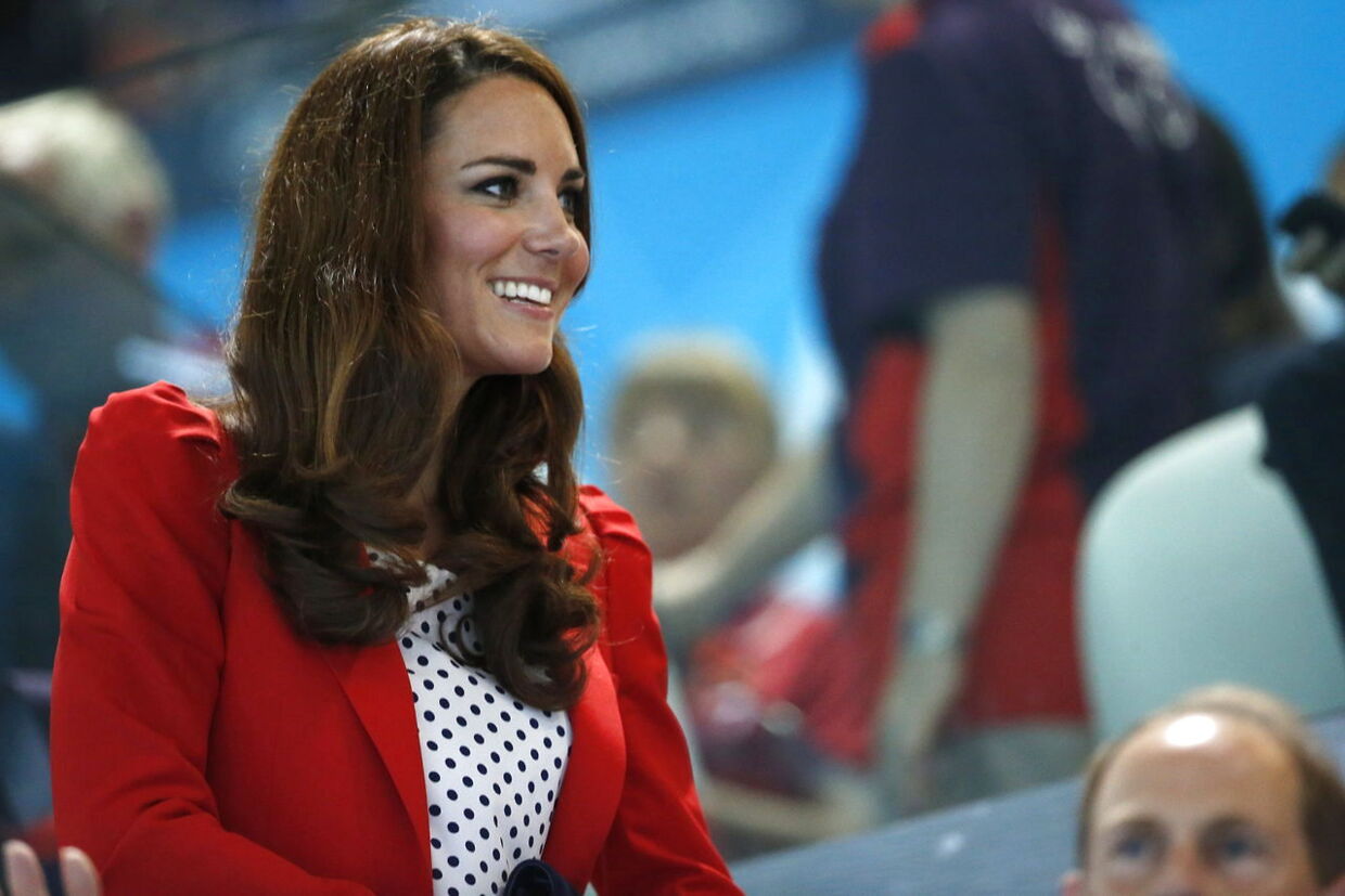 epa03338774 Duke (HRH Prince William) and Duchess (Kate) of Cambridge attend the Swimming competition held at the Aquatics Center during the London 2012 Olympic Games in London, England, 03 August 2012. EPA/PATRICK B. KRAEMER