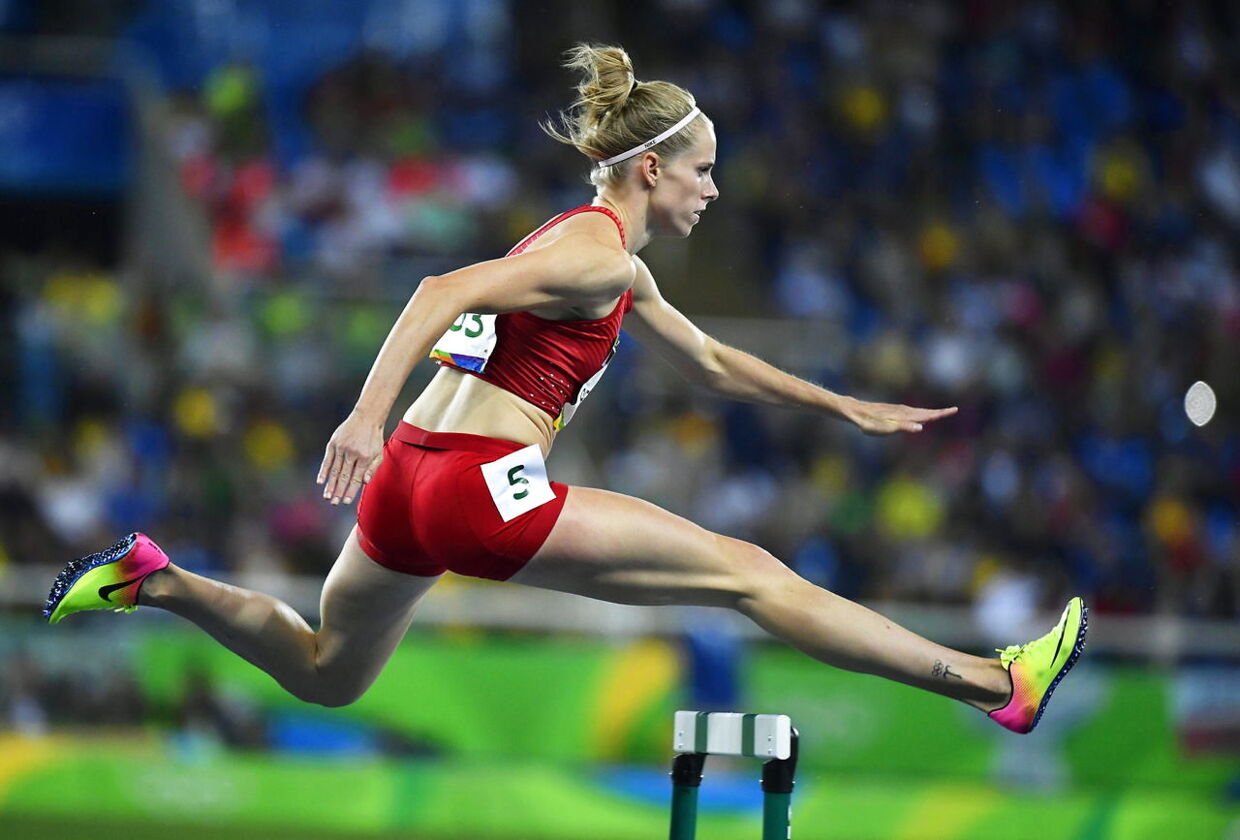 epa05488870 Sara Slott Petersen of Denmark competes during the women's 400m Hurdles heats of the Rio 2016 Olympic Games Athletics, Track and Field events at the Olympic Stadium in Rio de Janeiro, Brazil, 15 August 2016. EPA/FRANCK ROBICHON